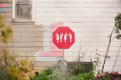 White walls near the red and white sign
